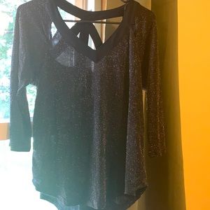 Small sheer black and gold top with open back